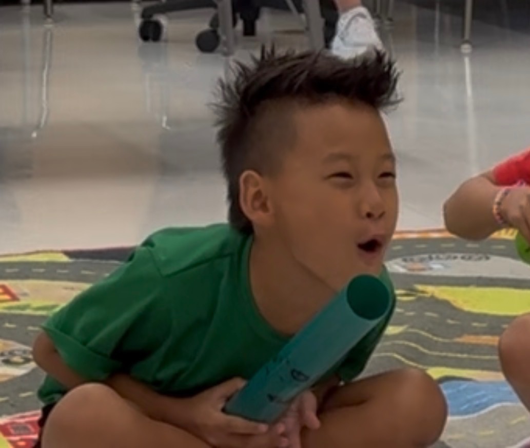 Hrehaan demonstrating a simple circuit to students