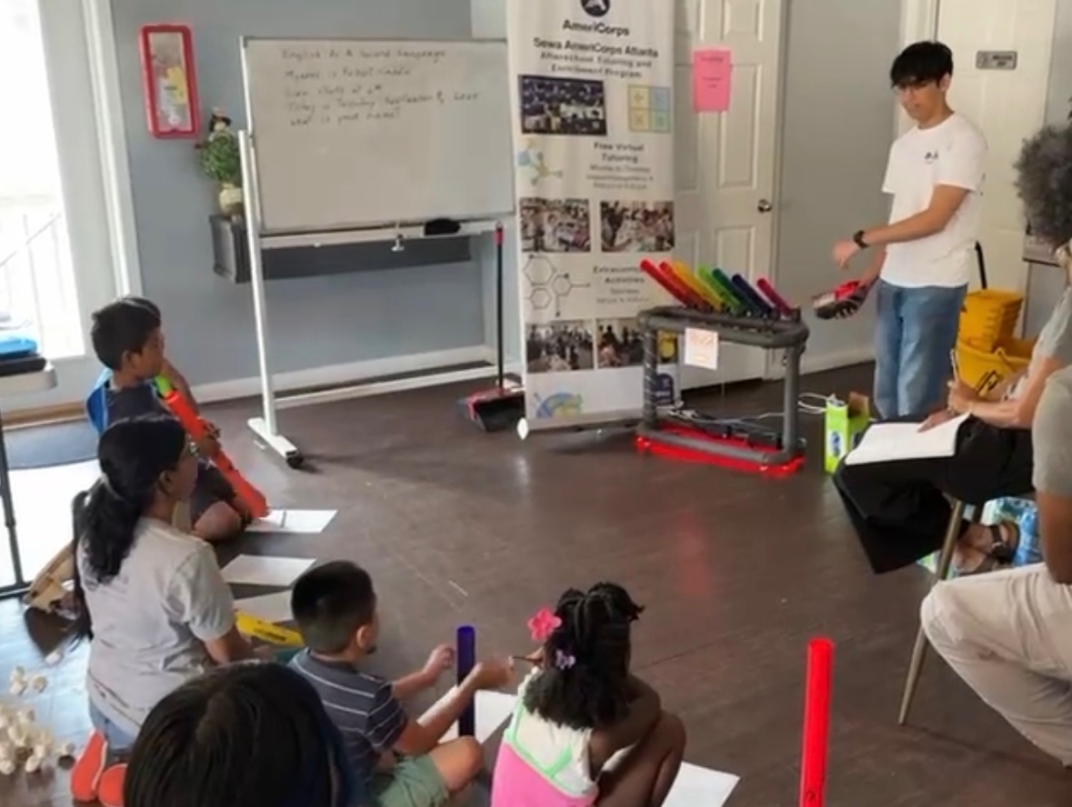 Hrehaan demonstrating a simple circuit to students