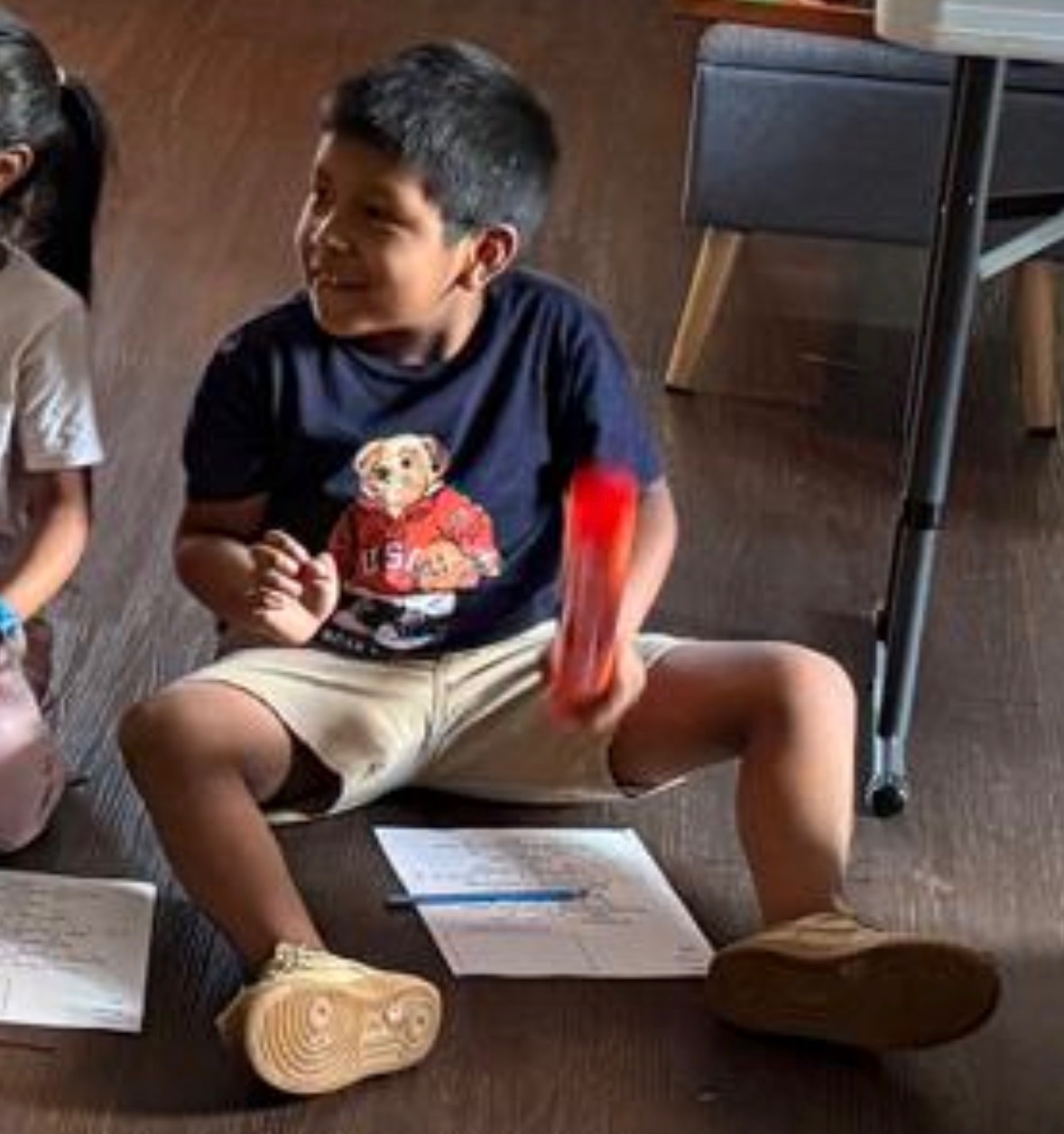 Student excitedly playing his boomwhacker
